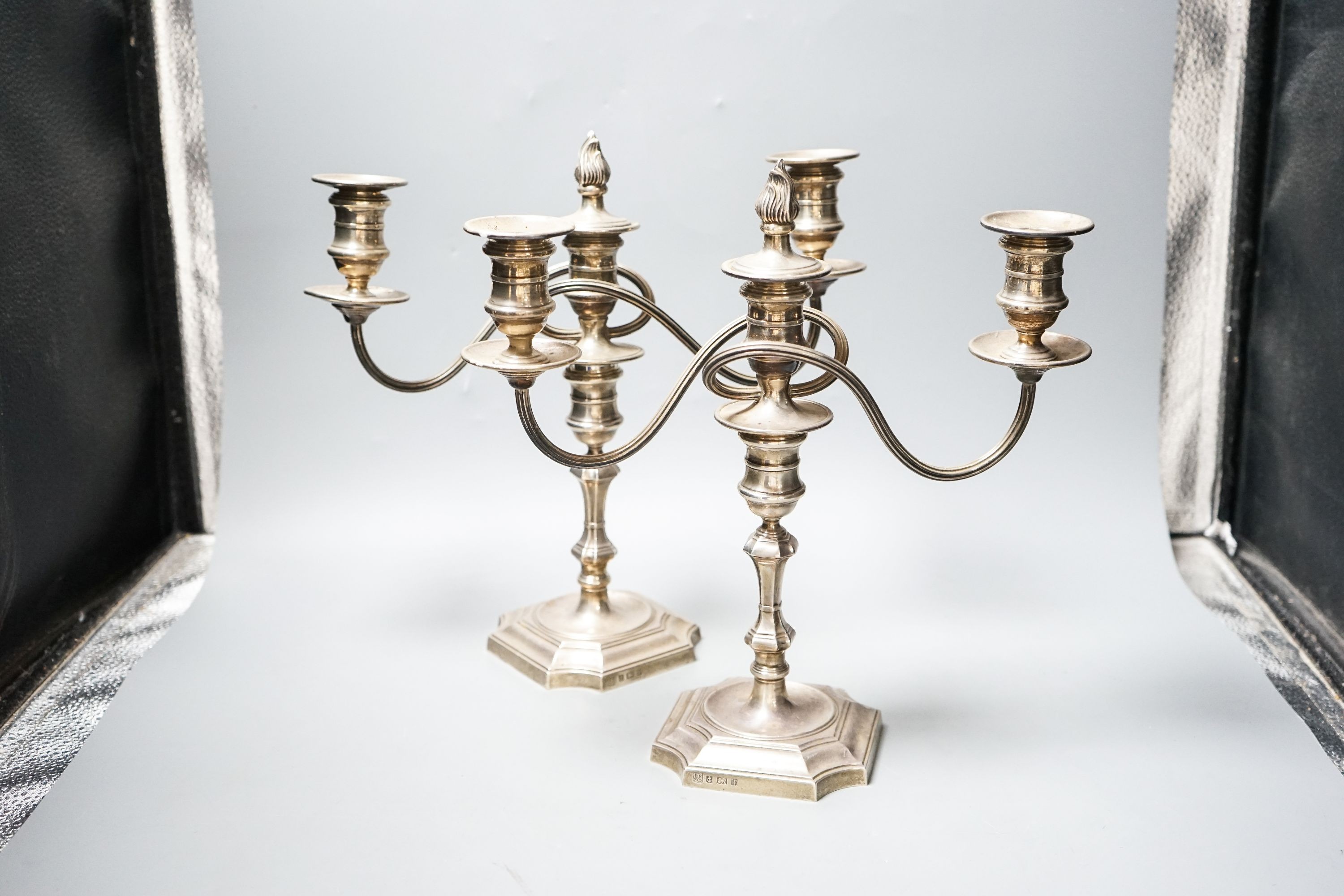 A pair of modern 1970's silver two branch, three light candelabra, height 30.4cm, weighted.